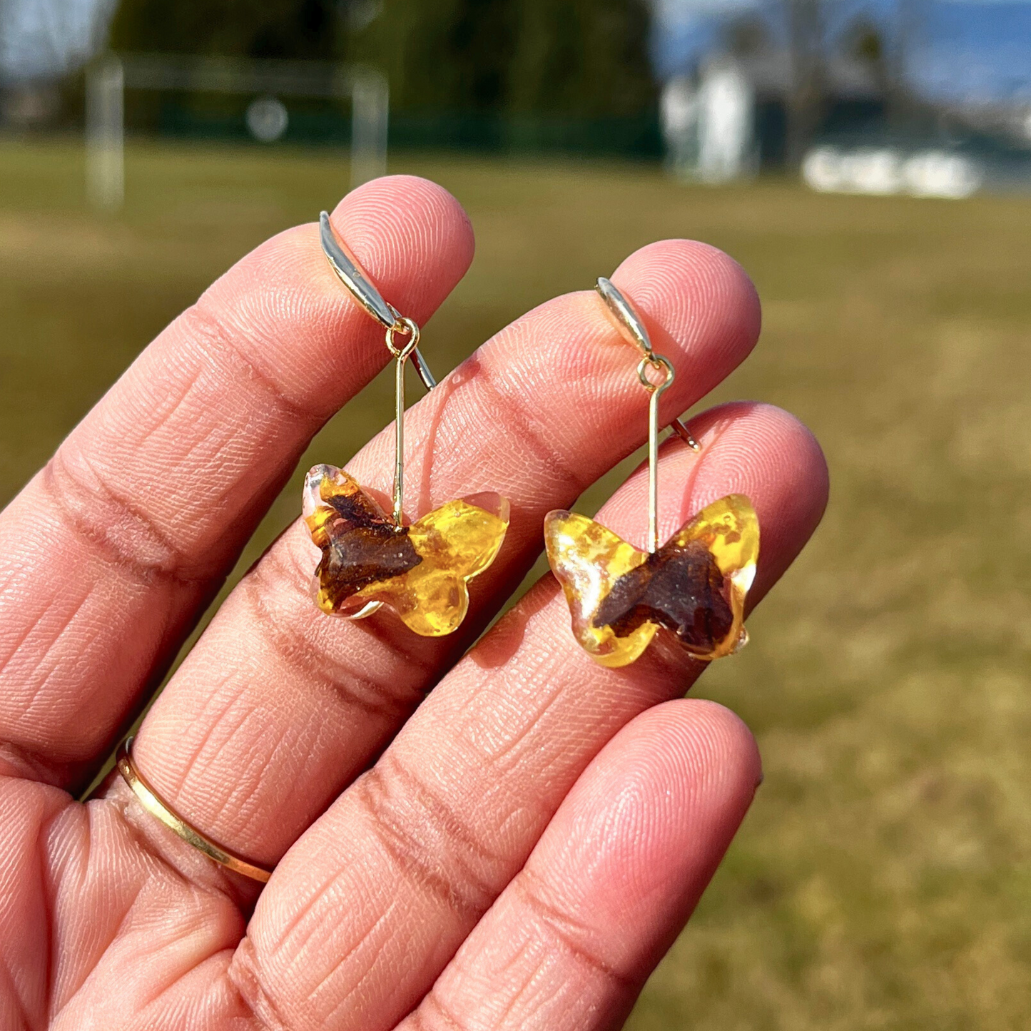 Butterfly earrings filled with Yellow Pansies